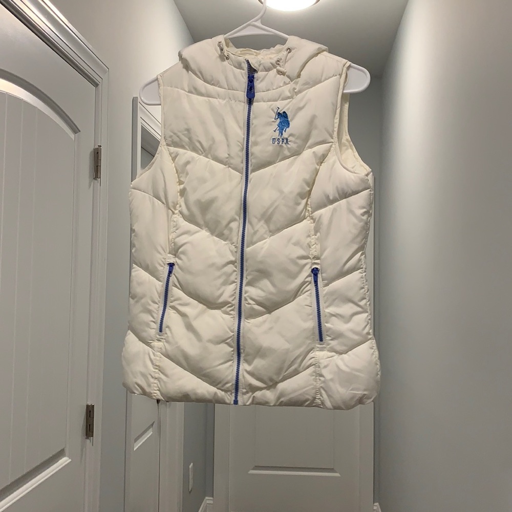 White puffy vest with blue detailing